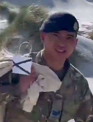 Soldier carrying a post bag