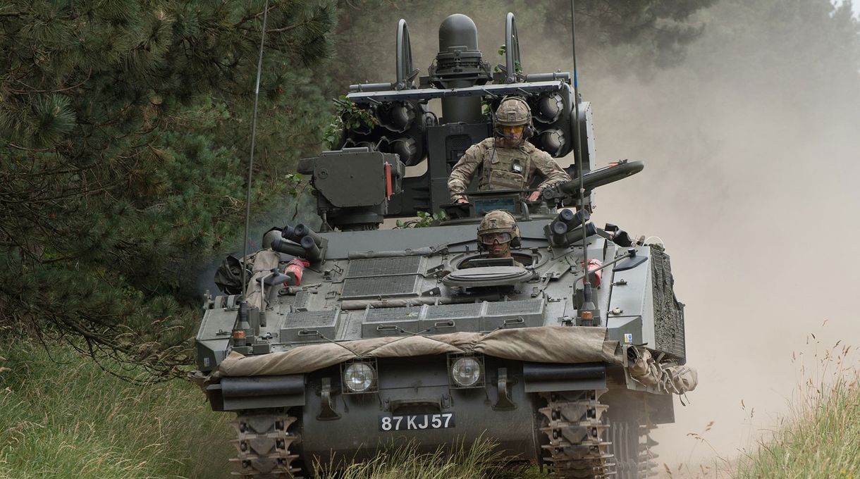 Gunners driving in an armoured vehicle