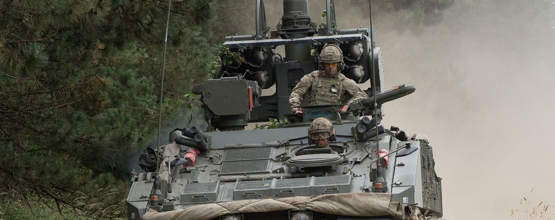 Gunners driving in an armoured vehicle