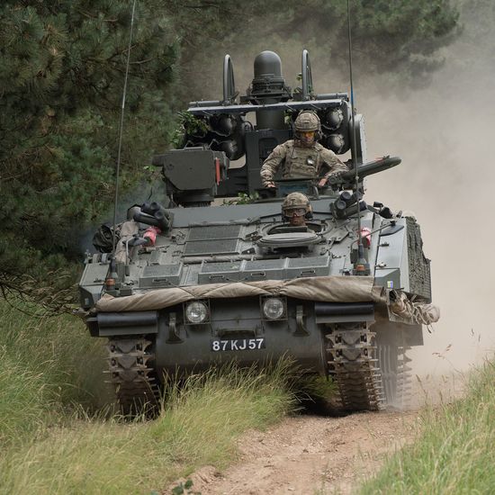 Gunners driving in an armoured vehicle