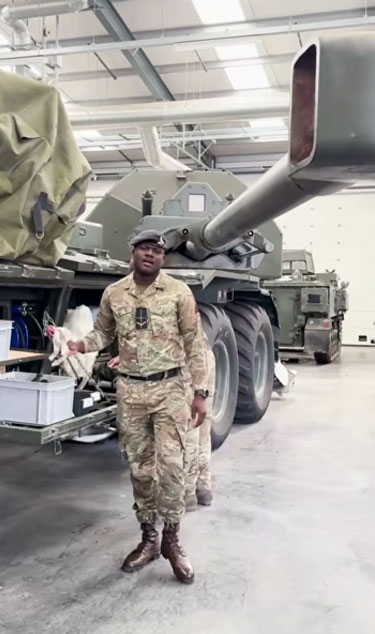 Soldiers standing in front of Archer, military kit