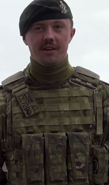 Soldier talking to camera with his beret on