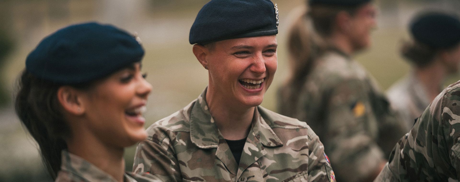 Two female soldiers laughing