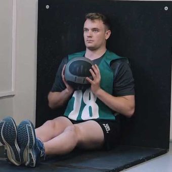 Seated ball throw