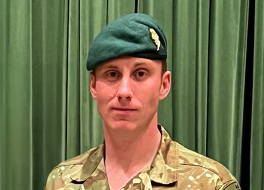 Male officer in a green beret