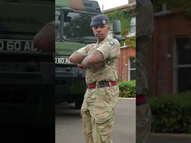 RLC soldier standing in front of a truck