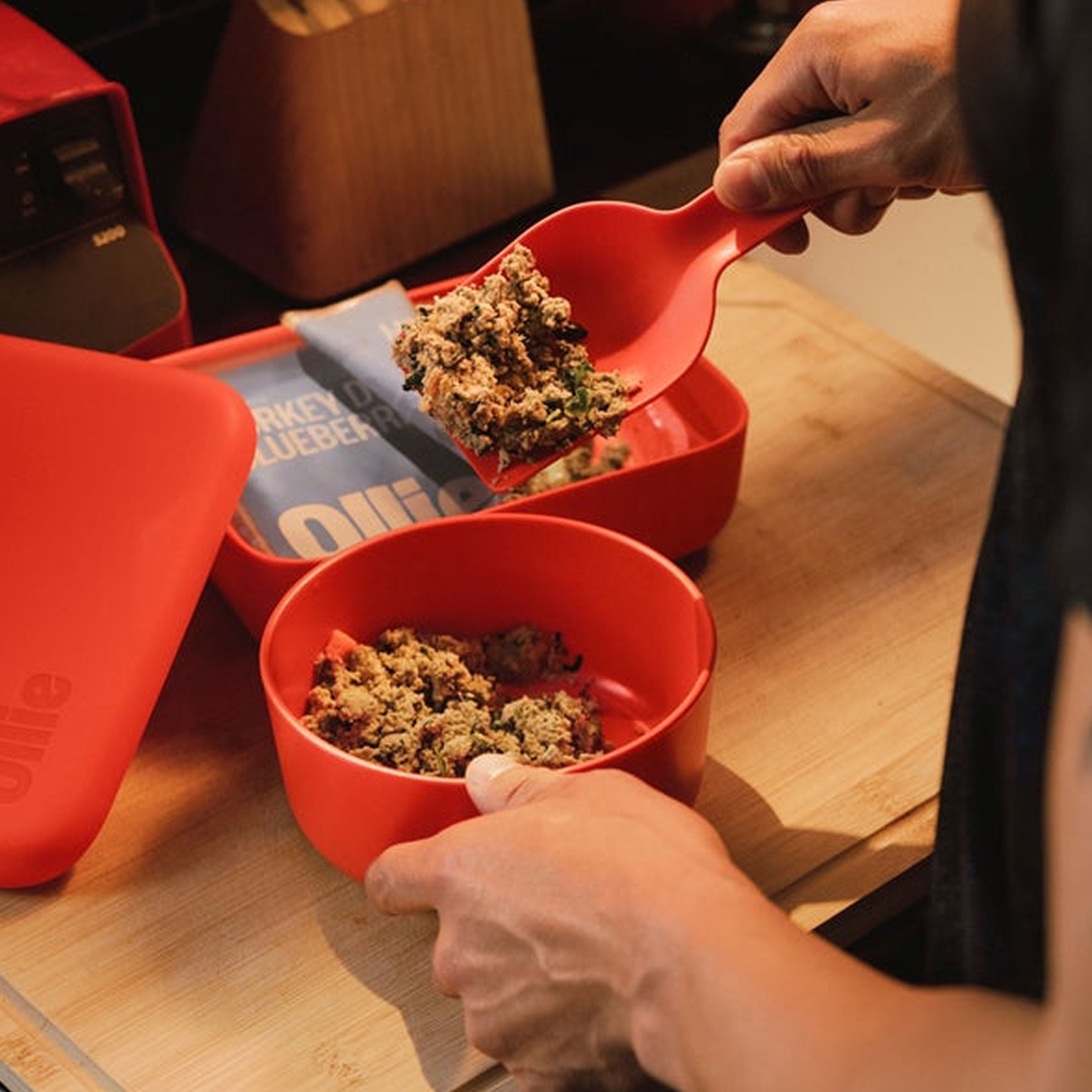 Serving Ollie fresh food with our custom scoop