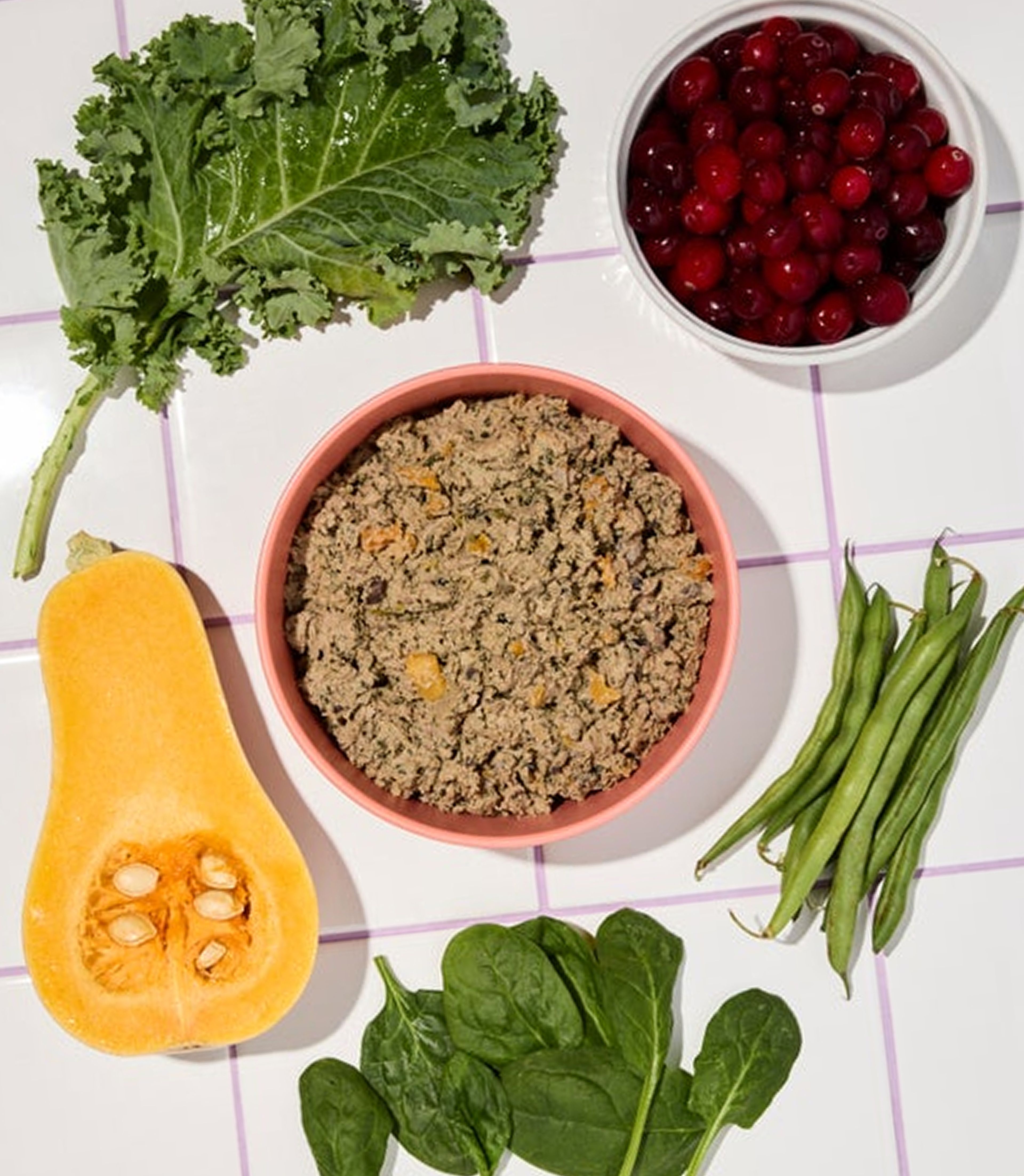 Bowl of fresh lamb recipe food surrounded by ingredients