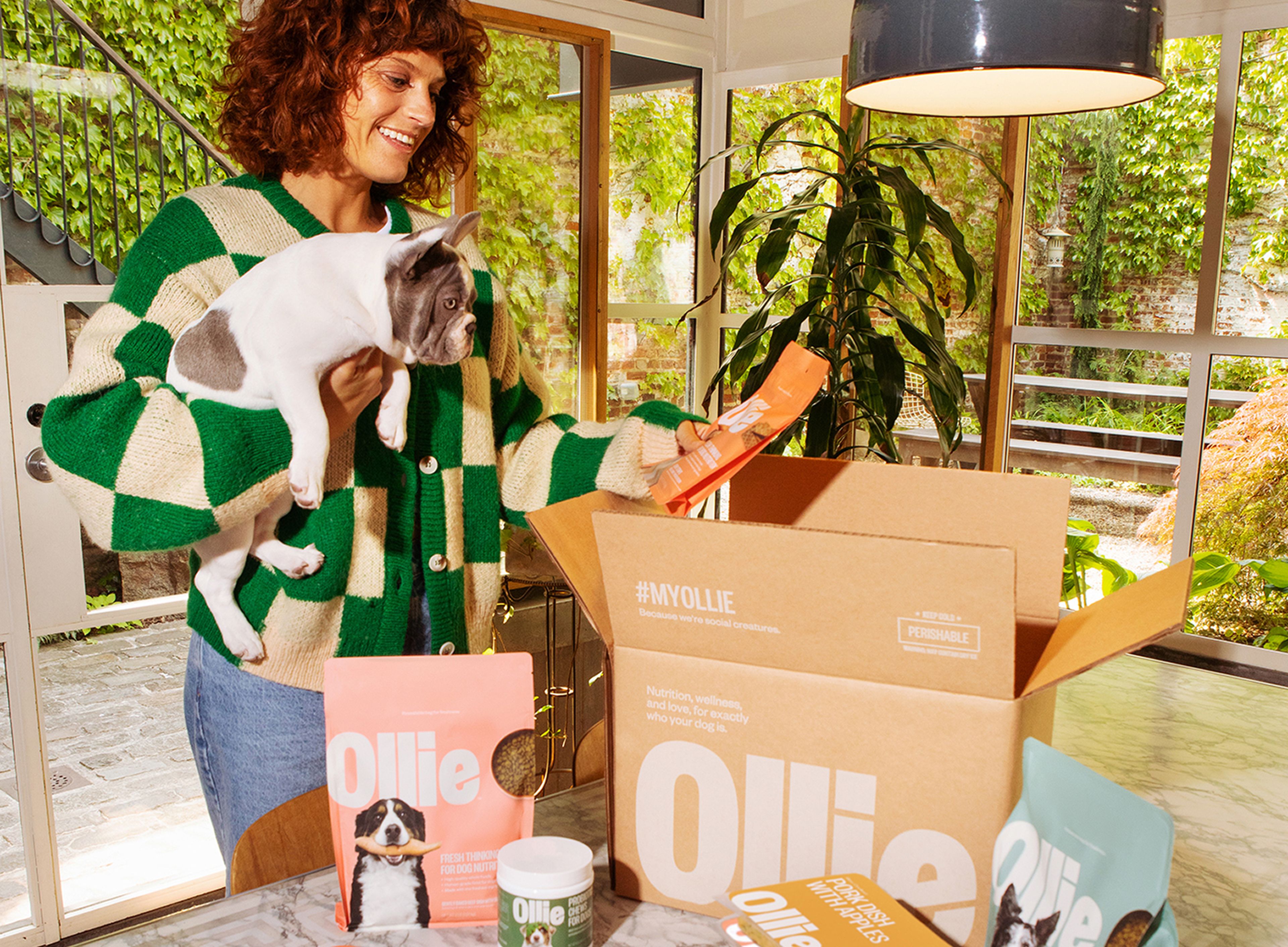 Image of a woman unboxing her treats and food