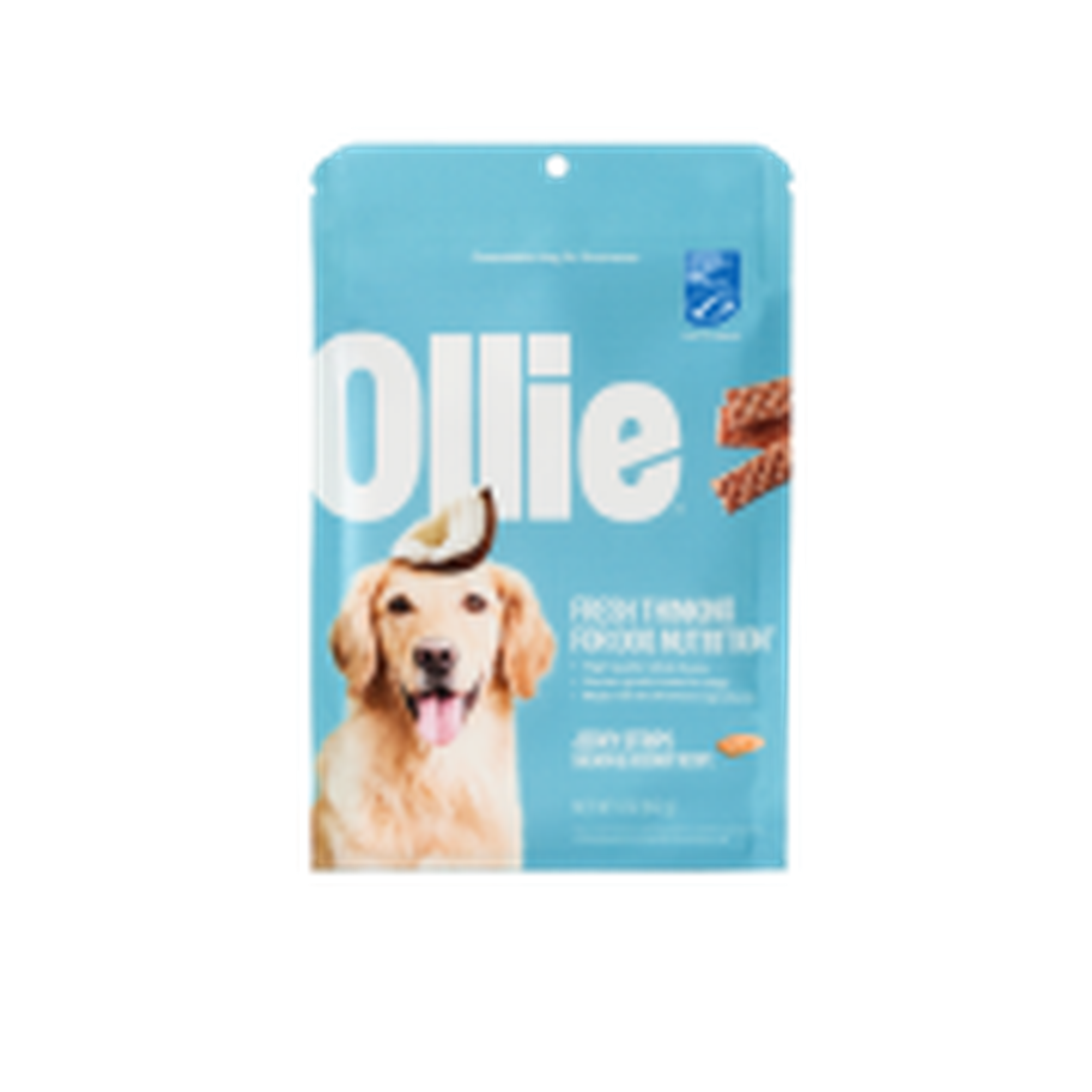 Blue dog food package labeled "Ollie" with an image of a Golden Retriever and a coconut slice on top.