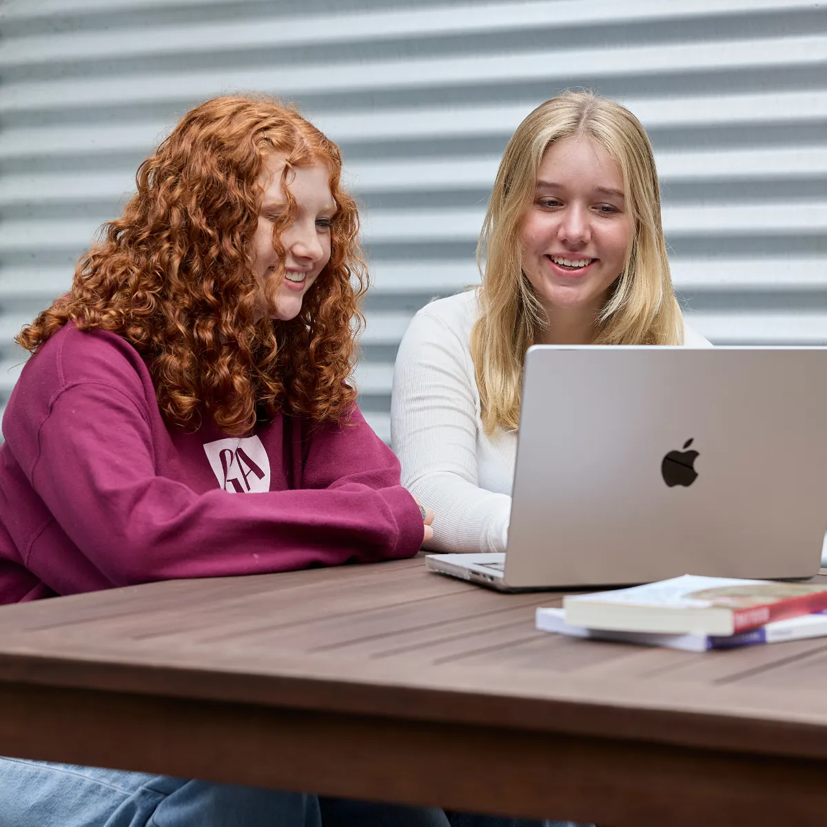 Two CGA students studying