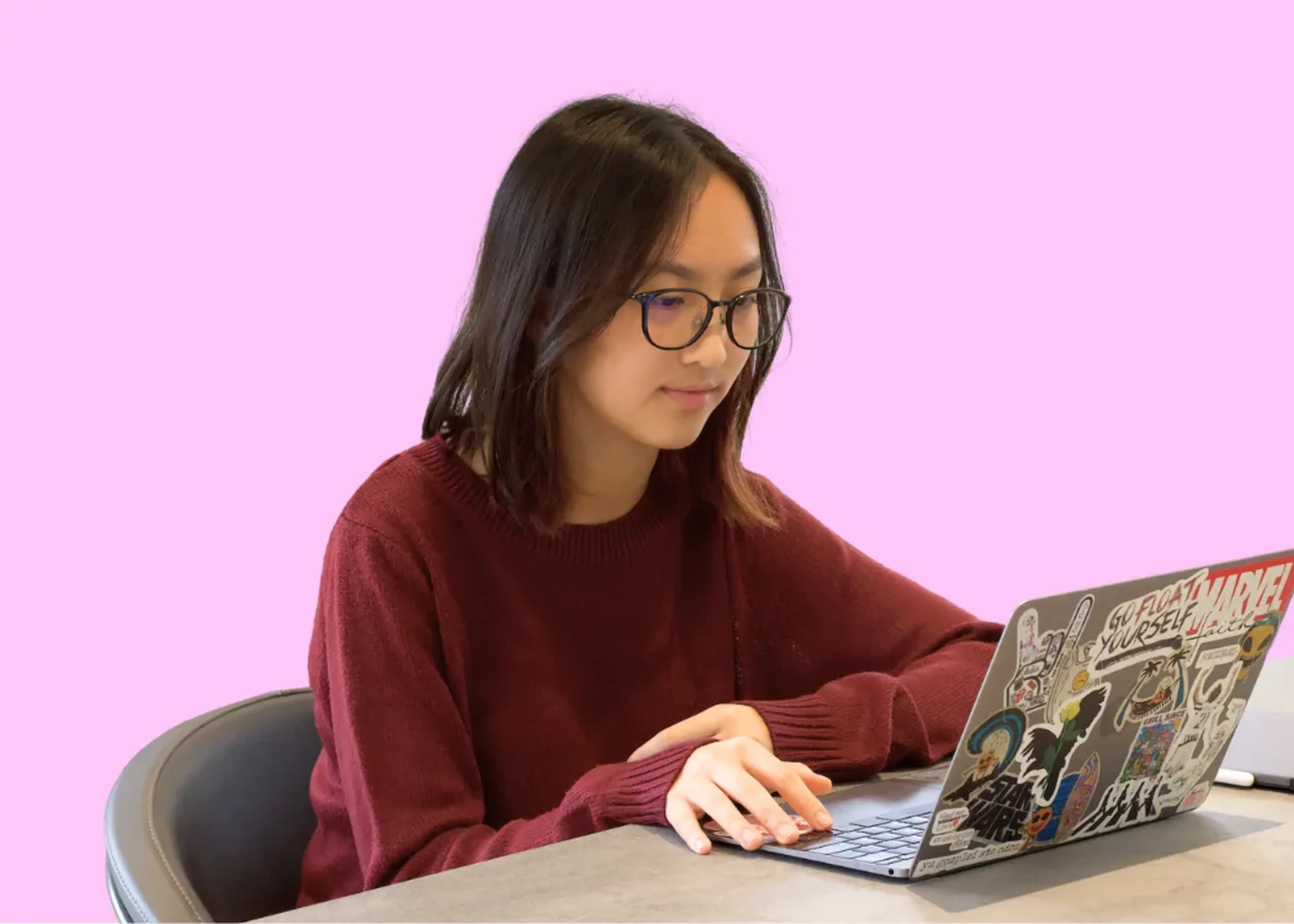 CGA student holding a laptop