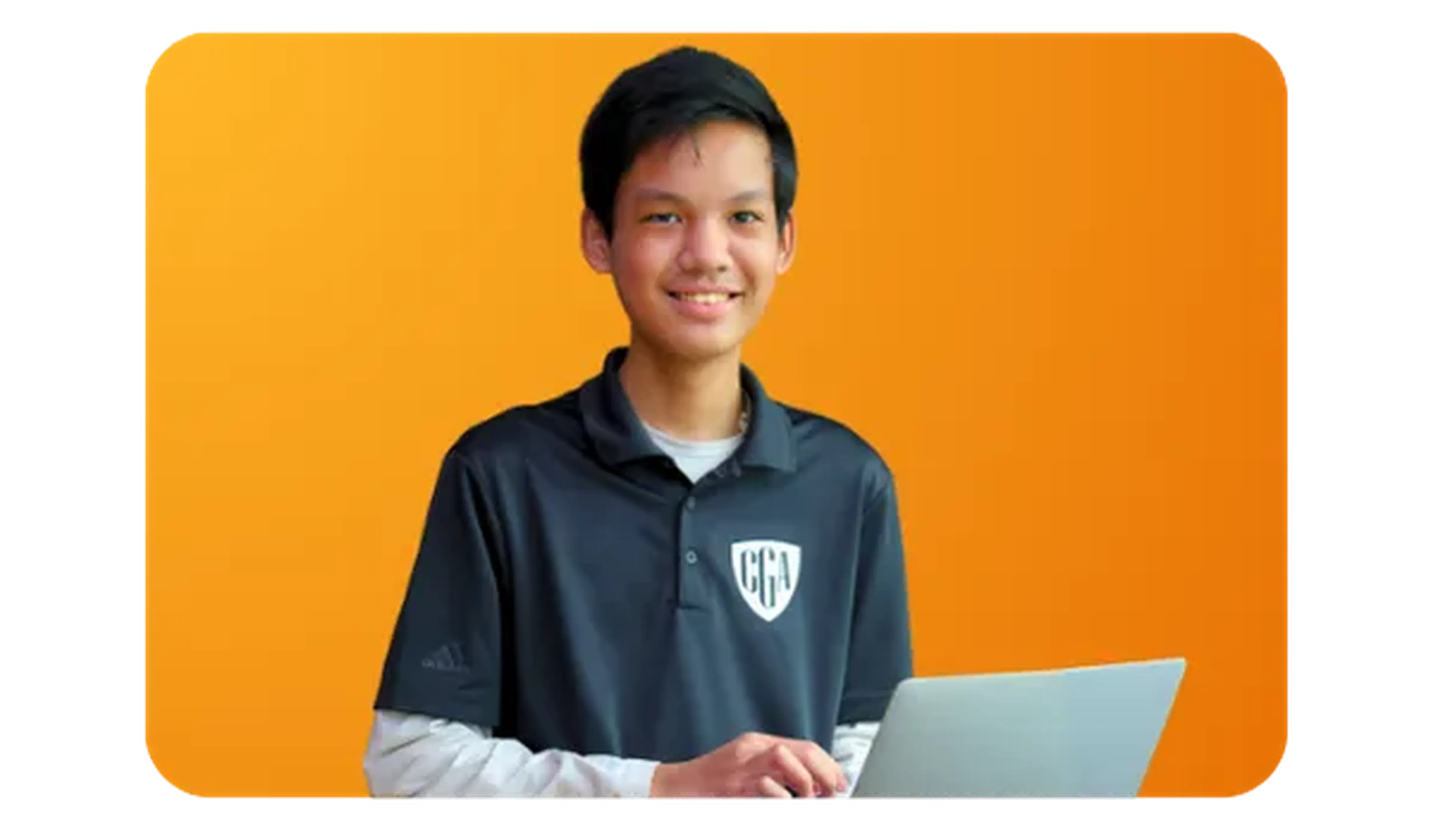 CGA student holding a laptop