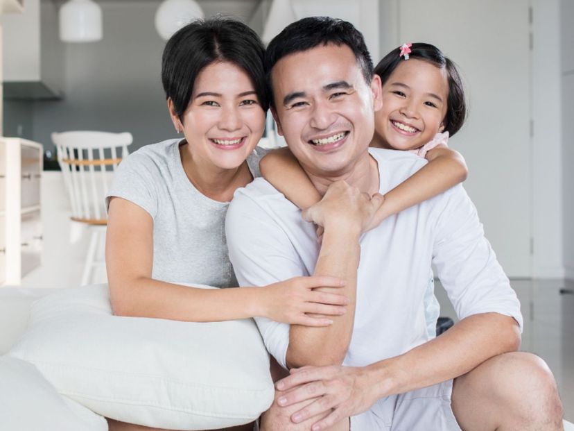Parents and their daughter enjoying time together at home