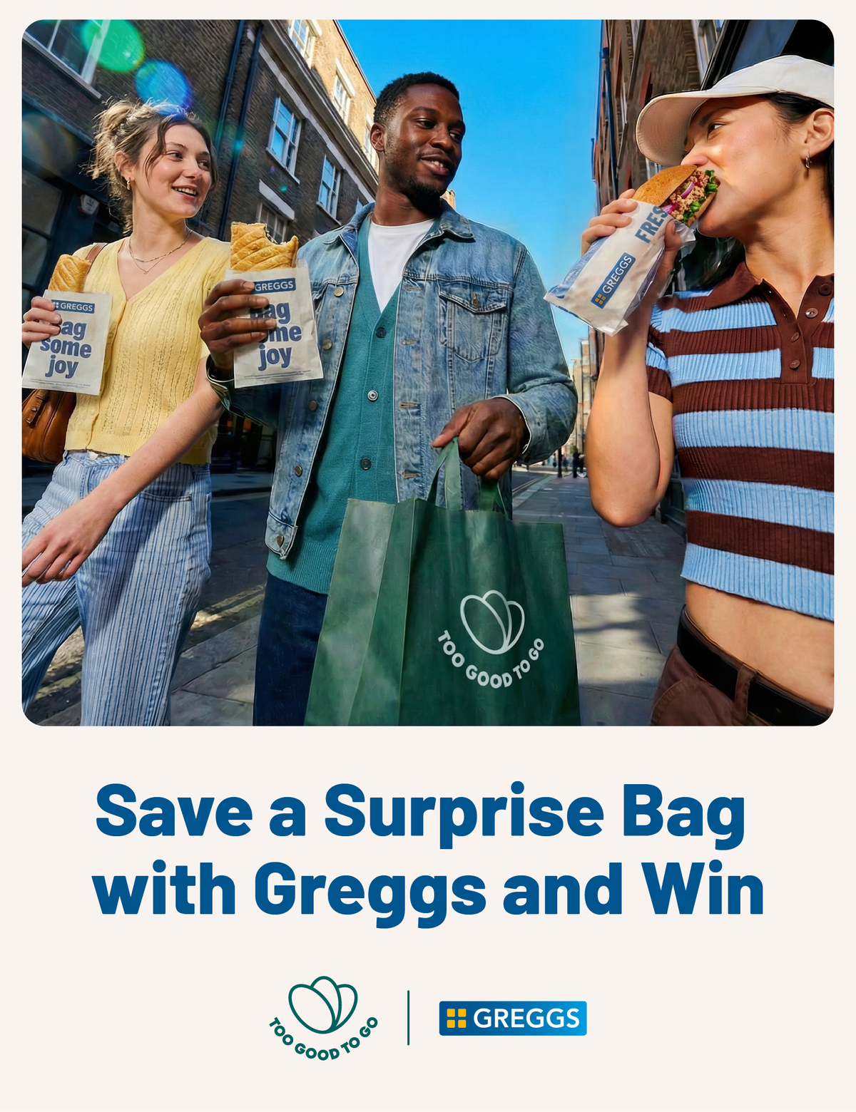 Three people on a street tucking into a variety of Greggs products. Beside, the words "save a surprise bag with Greggs and win" and Too Good to Go x Greggs logo