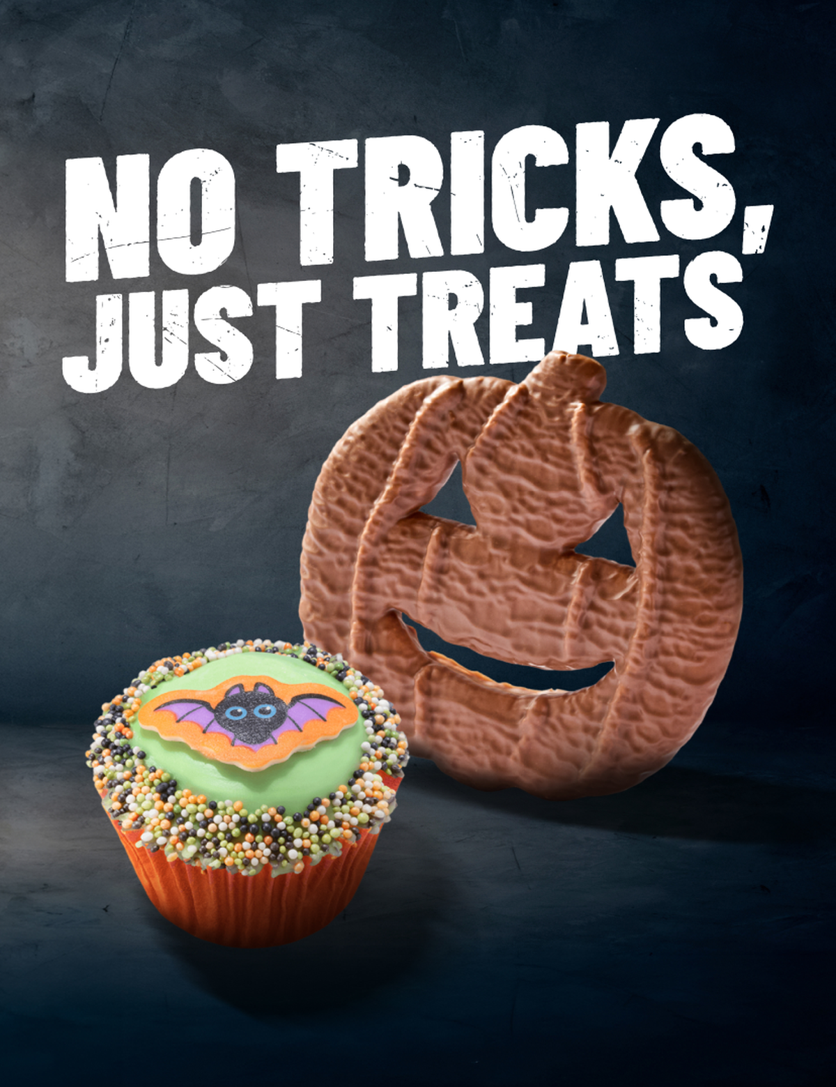 "No tricks, just treats" in white text beside a Pumpkin Biscuit and Spooky Bun on a black background