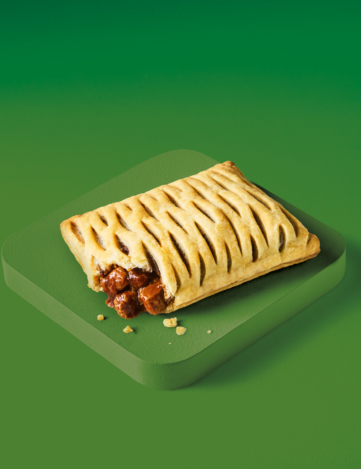 A Vegan Lattice (Steak-Free) on a green surface against a green background.