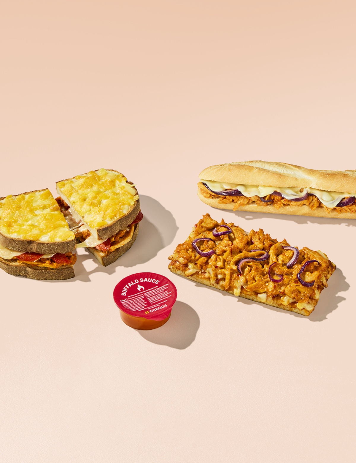 Chicken & Pepperoni Pizza Toastie, Buffalo Chicken Baguette and Buffalo Chicken Pizza on a pink background