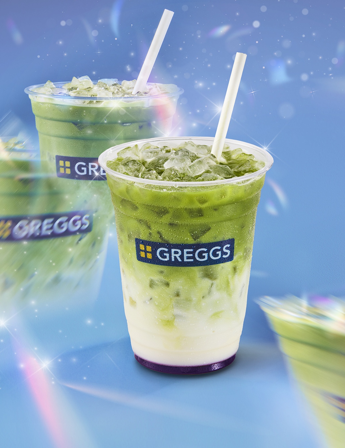 A Blueberry Iced Matcha on a blue background with a prismatic effect