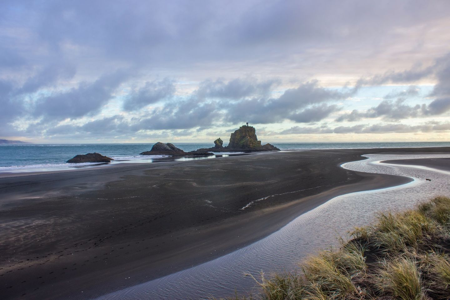 A cloudy day at Whatipu Beach in Auckland, New Zealand.
