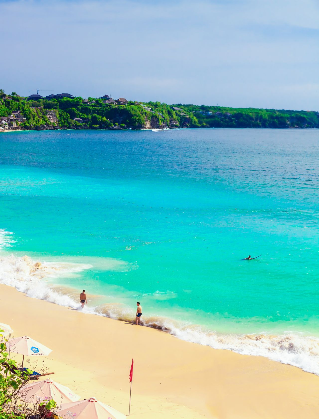 A sunny day at Dreamland Beach in Bali, Indonesia