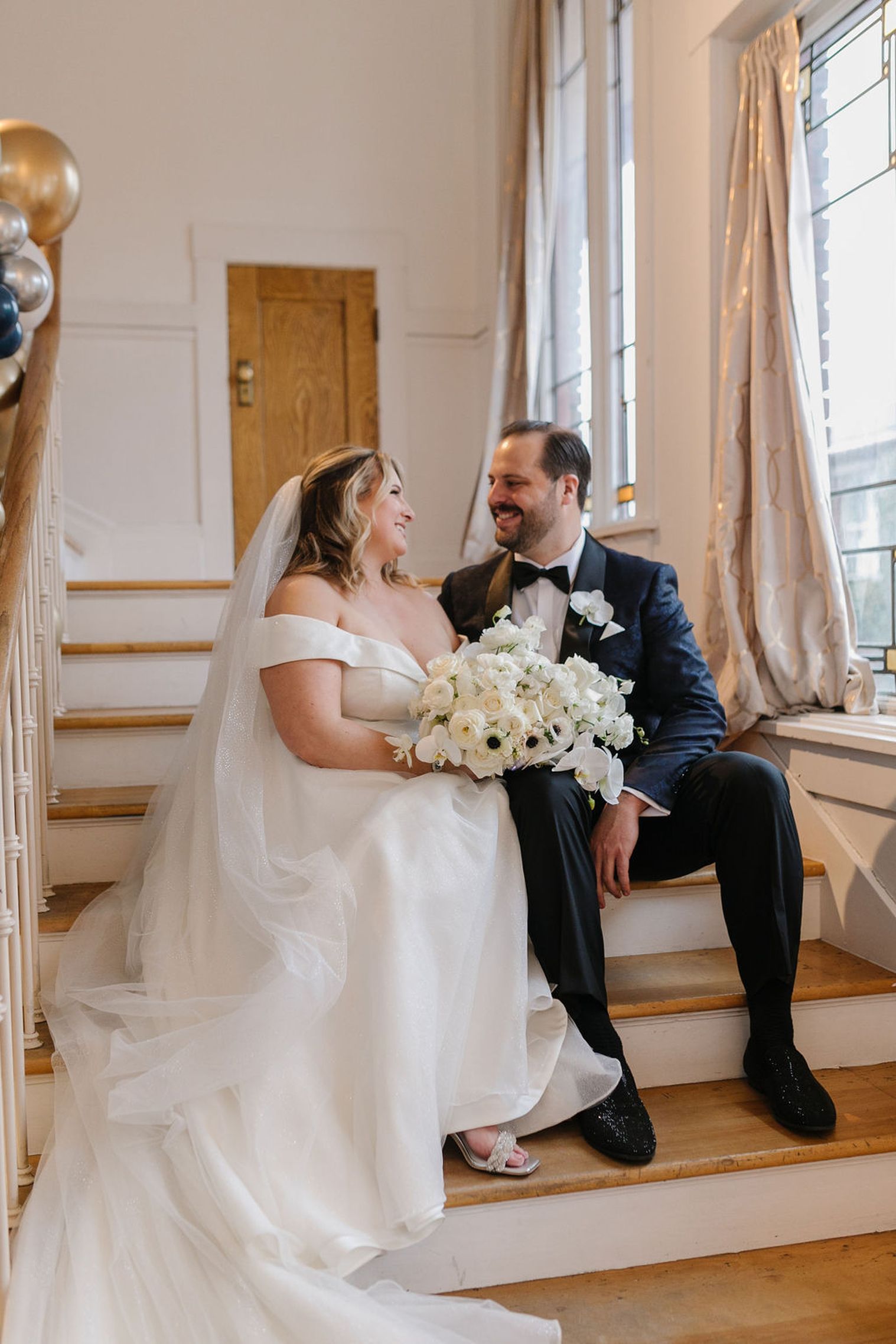 bride and groom on stairs