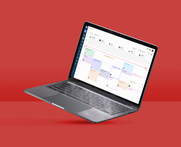 laptop with reservio app on red background