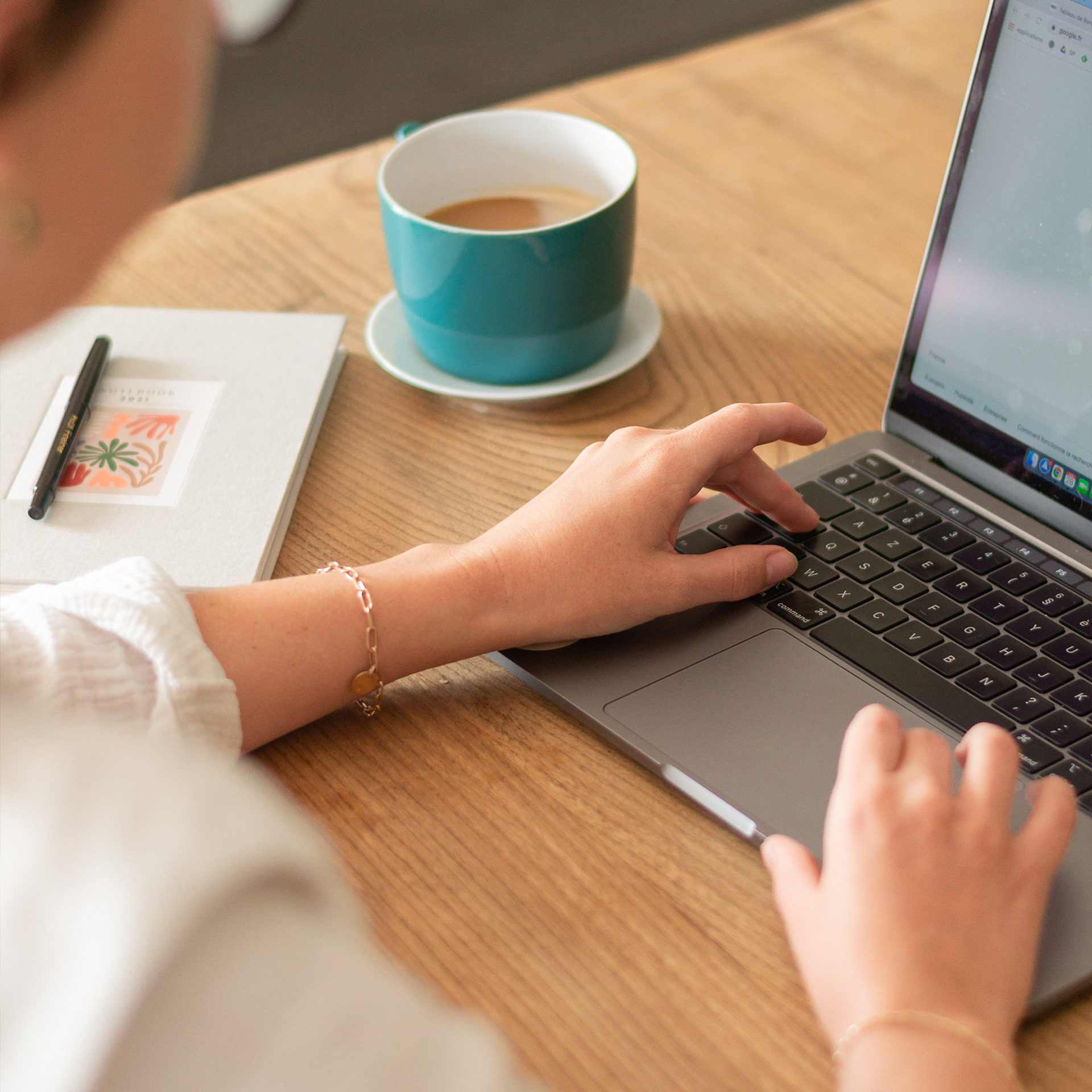 desk with a coffee and computer