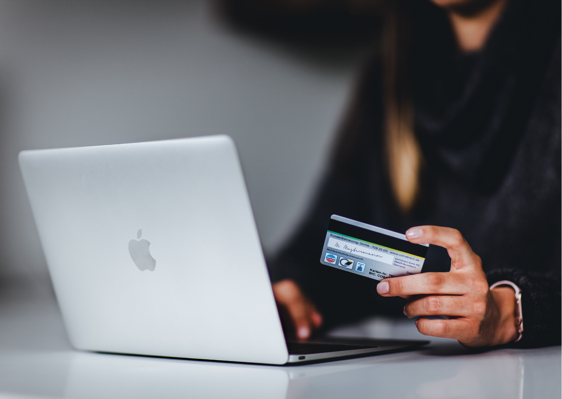 Woman paying online by credic or debit card