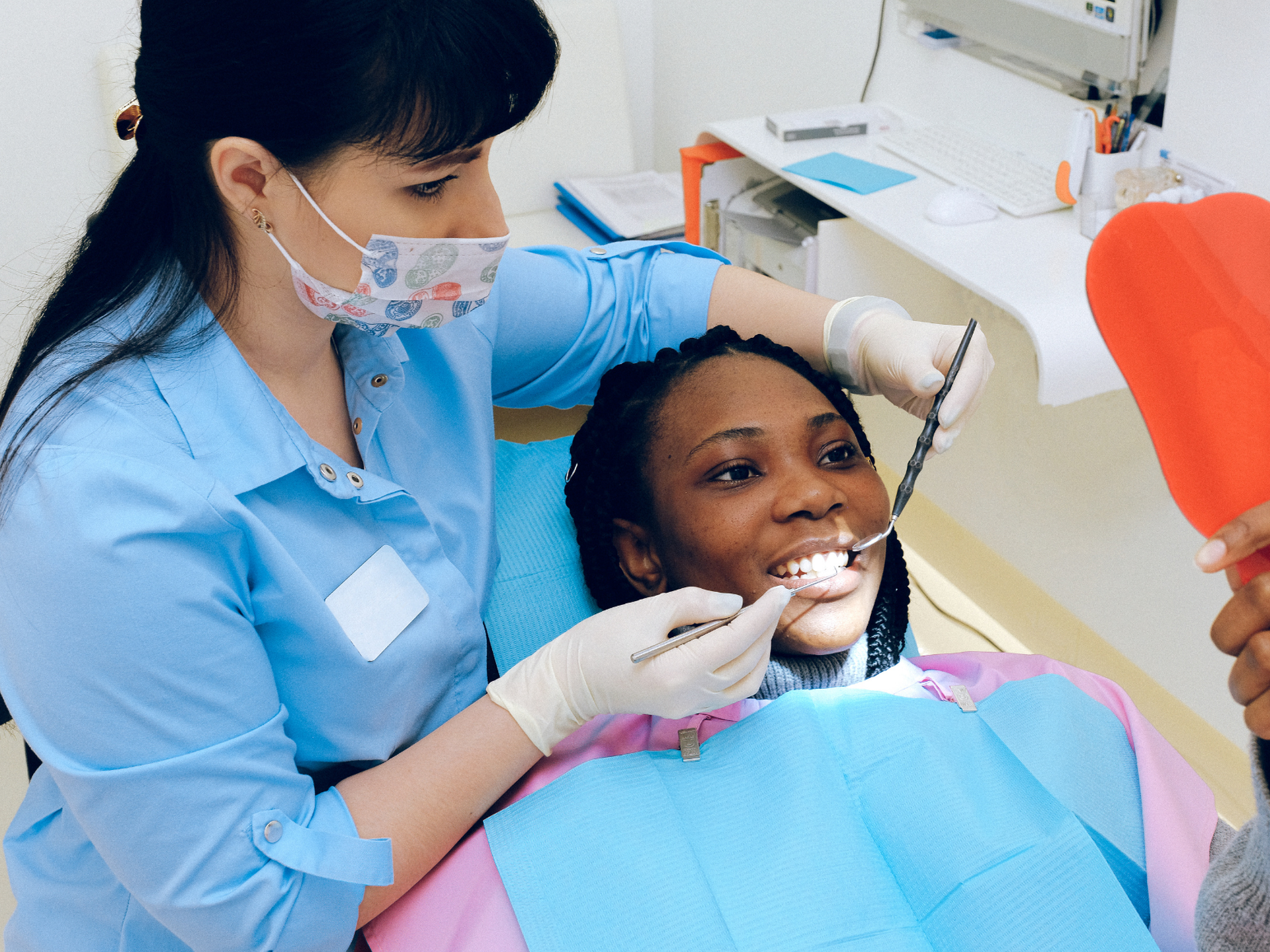 Dentist and woman patient