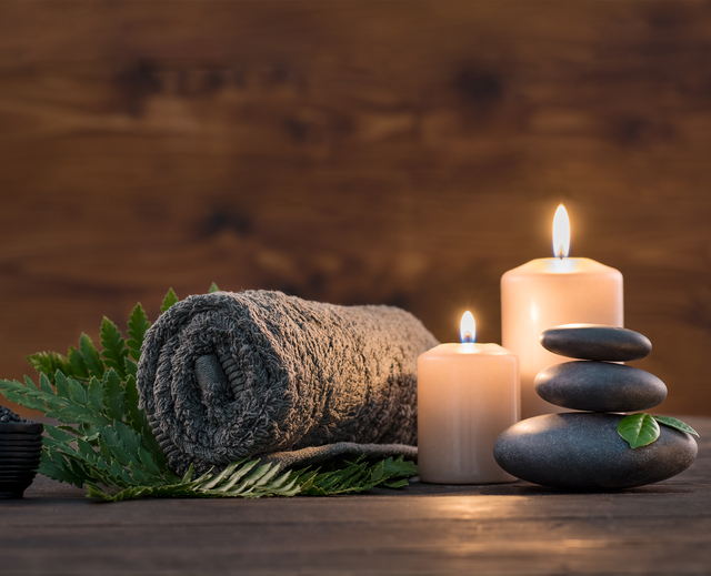 Candles and towel in wellness