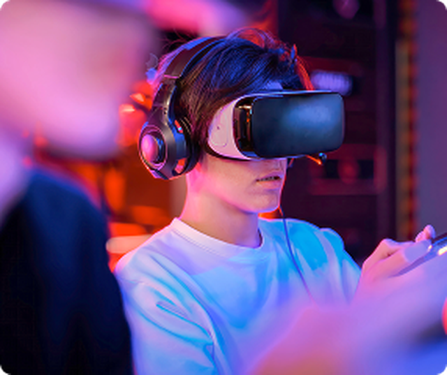 boy wearing VR headset while playing a game