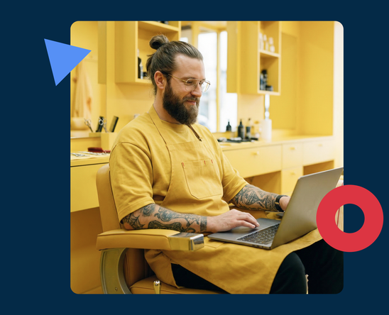 Barber with laptop with online booking