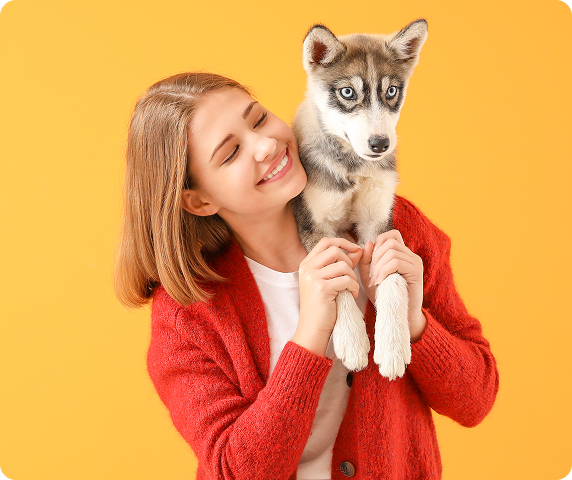 smiling womant with a dog