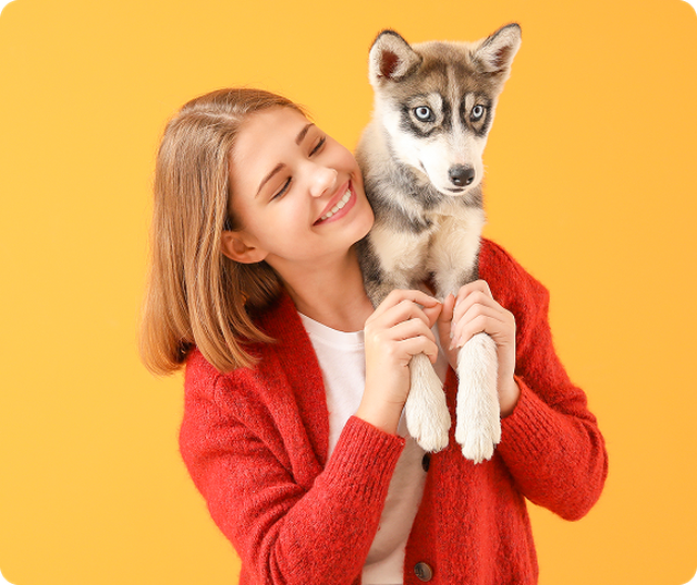 smiling womant with a dog
