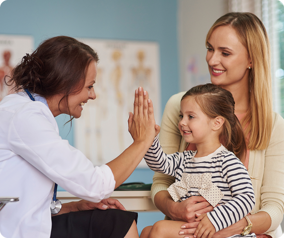 Pediatric doctor caring for a child