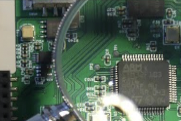 circuitboard with magnifying glass