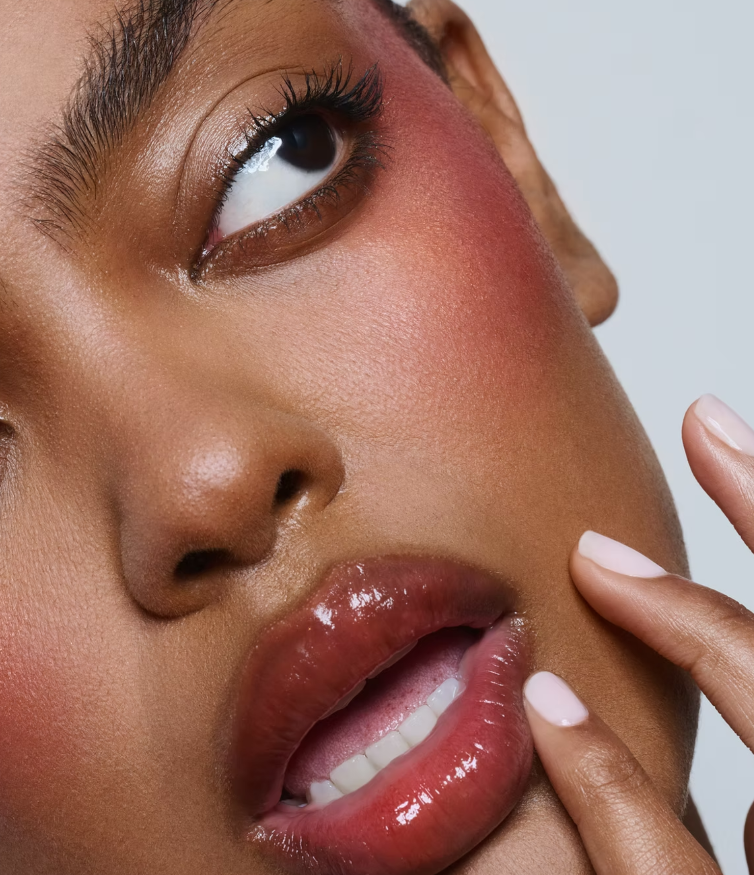 Model photographed by Monika Lis wearing berry-tinted gloss and light pink blush