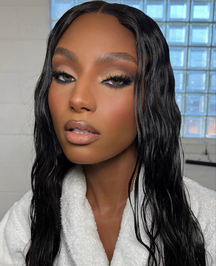 Beauty look on Sydney Harper featuring warm brown lips and bronze-toned blush