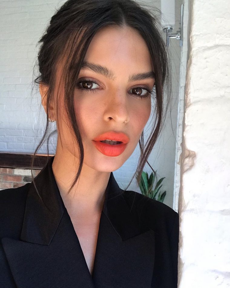Emily Ratajkowski wearing orange lips and warm tangerine blush makeup look
