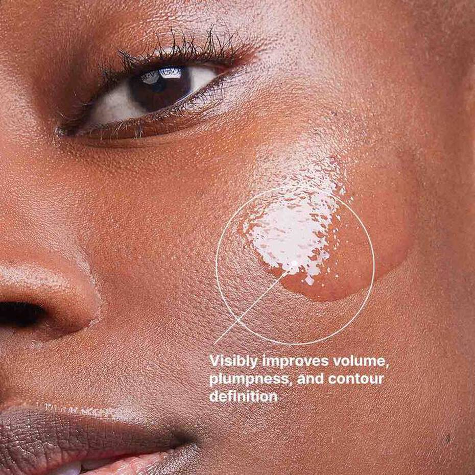 Skincare image of a woman applying a hyaluronic acid volumising serum, highlighting plump and radiant skin with SkinCeuticals Multi-Glycan technology