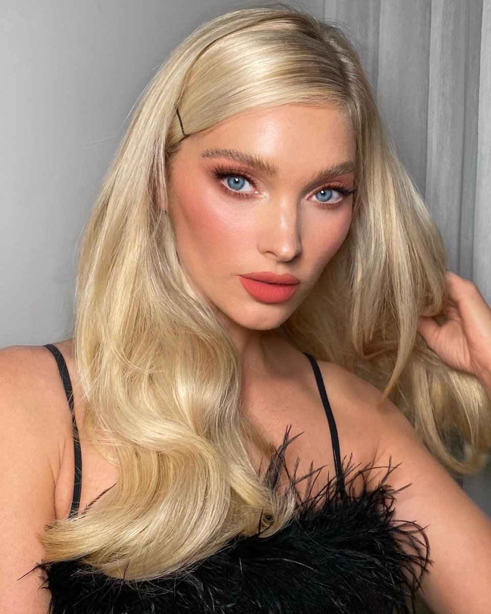 Elsa Hosk showcasing soft peach lipstick and apricot-toned blush