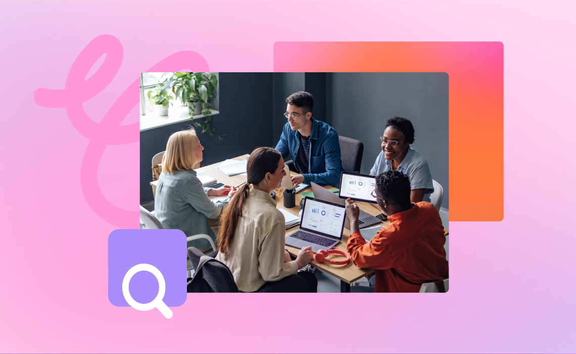 A diverse group of people collaborate around a table with laptops, discussing content on their screens in a modern office with colorful decor.