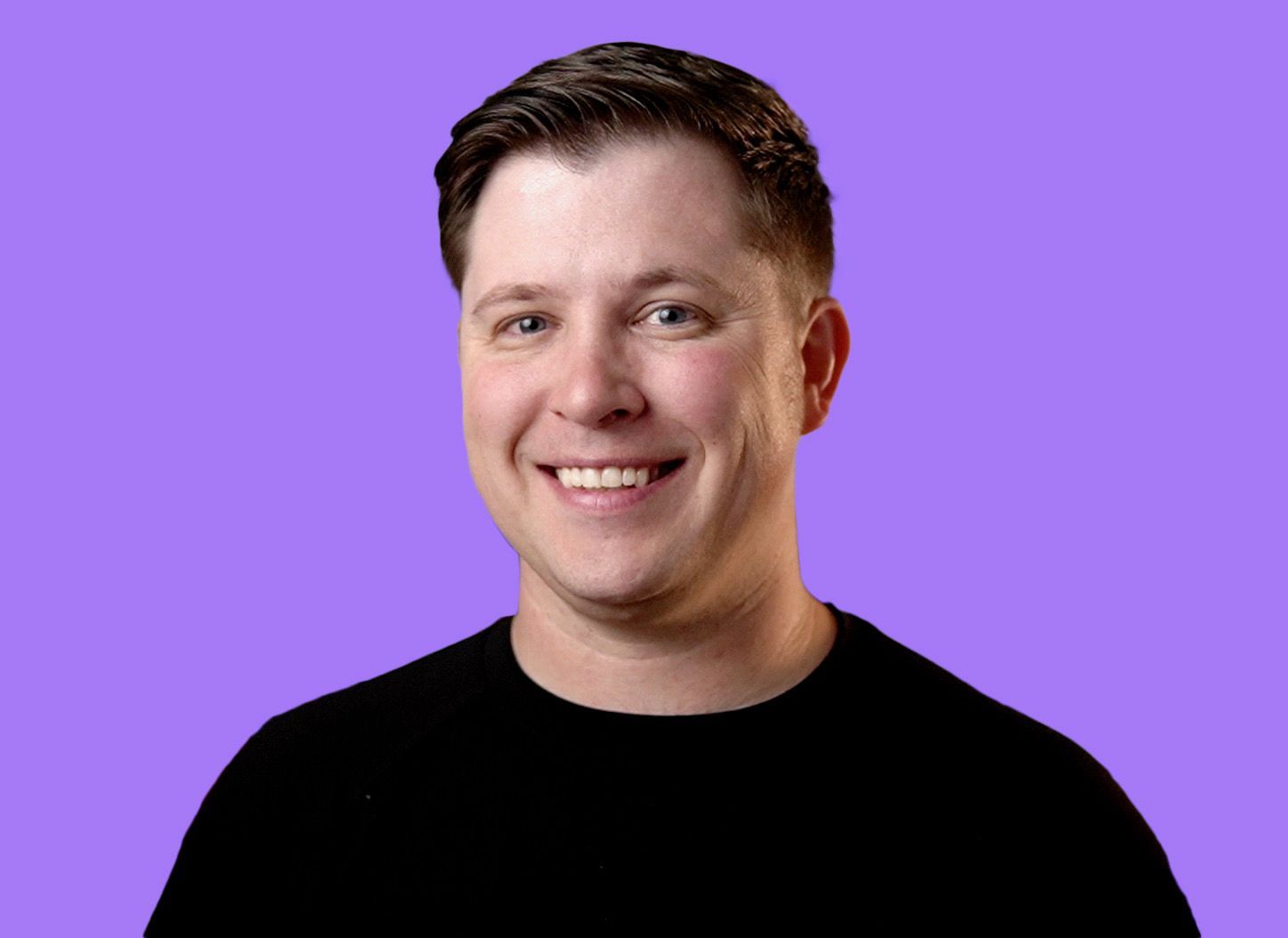 Logan Lyles smiling in a professional headshot