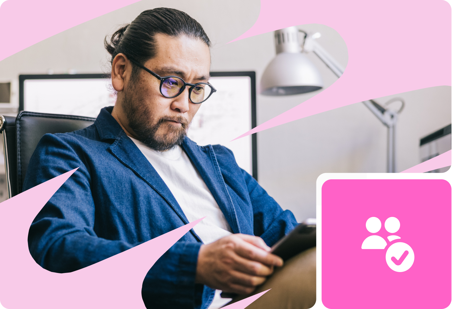 Man with glasses using a tablet in an office with a computer and desk lamp, framed by a pink design with a user checkmark icon.