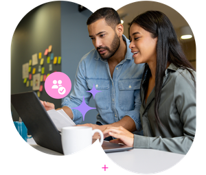 Man and woman collaborating at a laptop in an office, with sticky notes on the wall and digital teamwork icons.