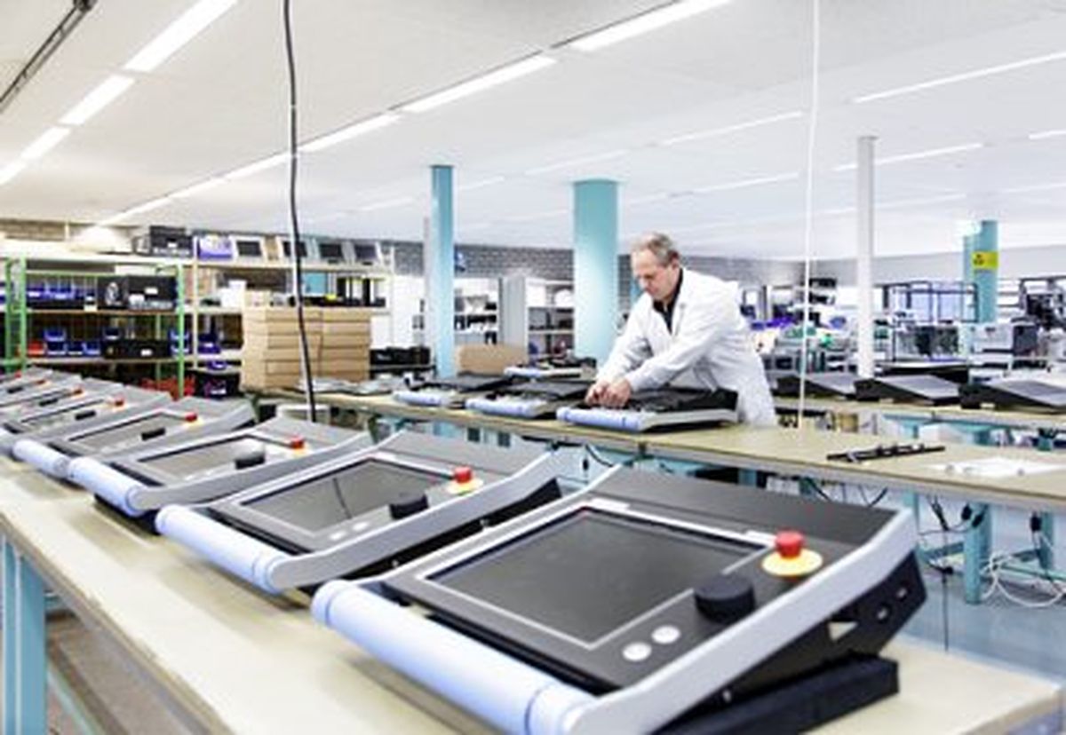Man works in the production hall at Delem