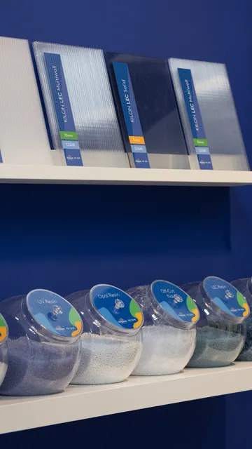 RECOVR display at the Kingscourt RECOVR Centre showing Kingspan LEC polycarbonate samples and recycled granules